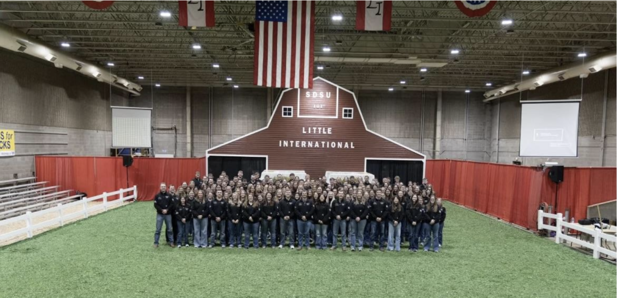 Students who served on the 101st Little International Committee in front of the new barn.